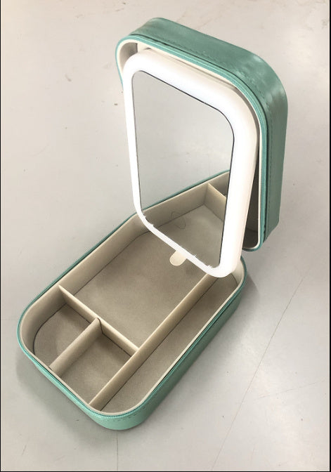 Portable green LED makeup mirror with storage compartments, touch light, USB charging, and HD mirror for travel and cosmetics

