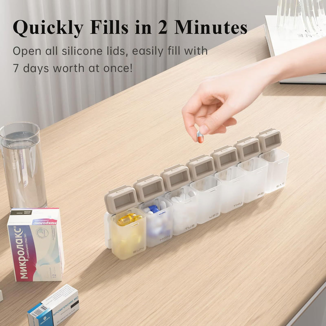 7-day magnetic pill organizer with large labeled compartments for vitamins, supplements, and capsules, shown with measurements and daily labels from SUN to SAT.
